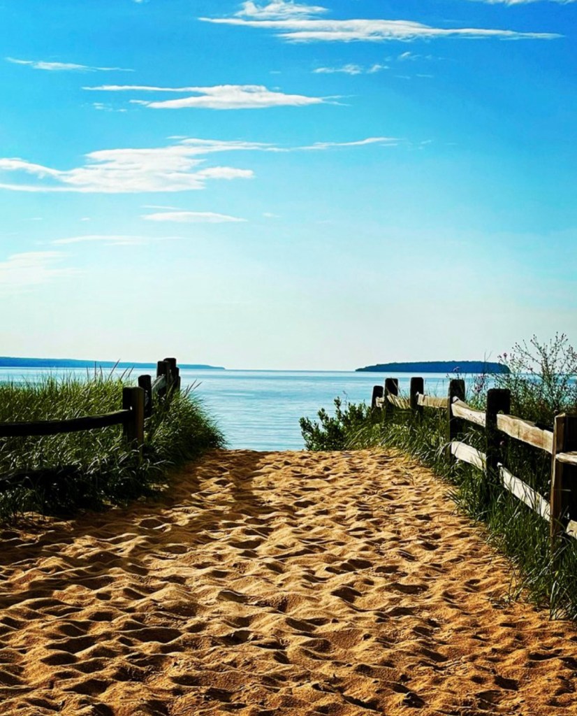 I took this picture heading towards the water in Au Train, Michigan.  I was fascinated by all the impressions of footprints in the sand.  So many stories to be discovered.  Come along for the ride!